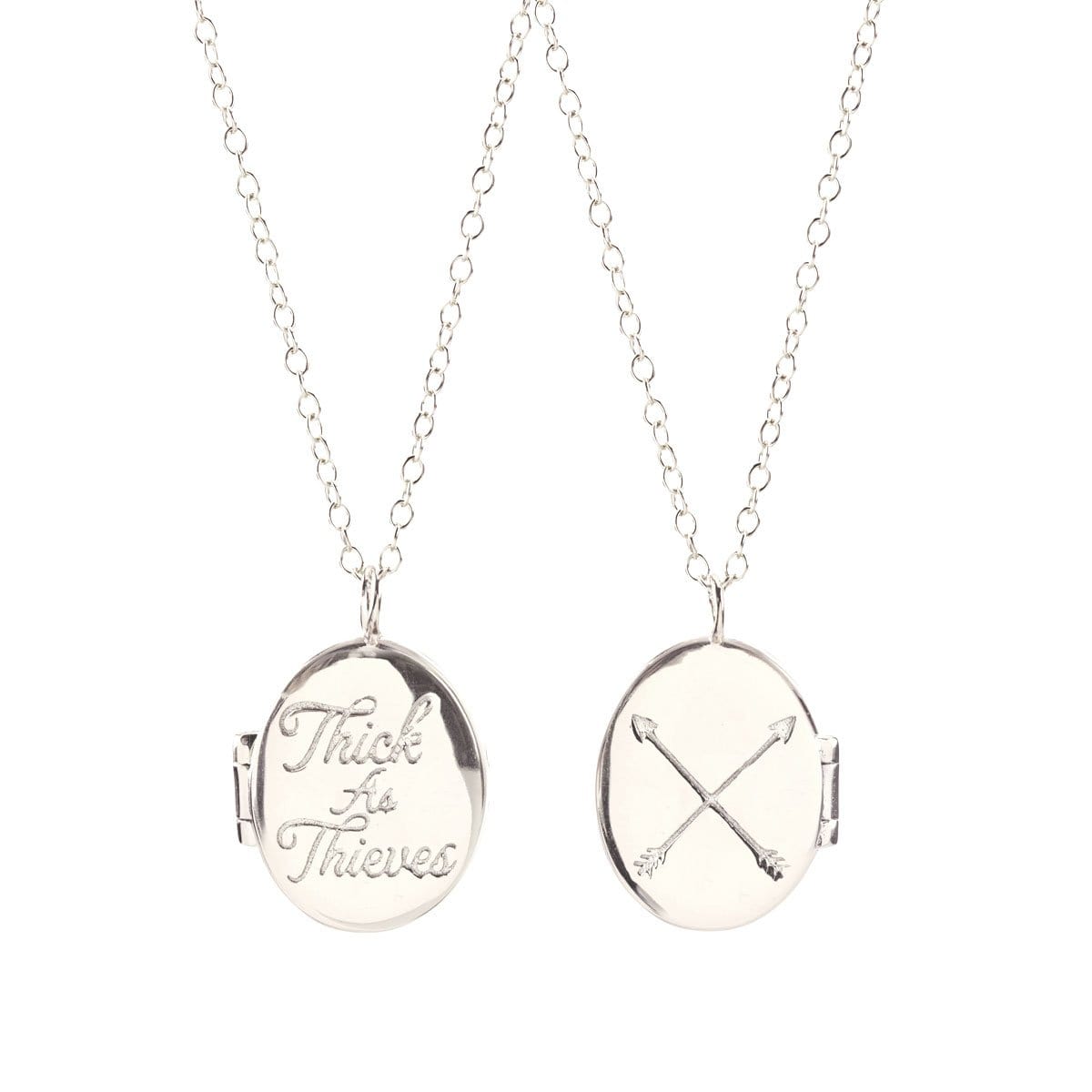 Thick As Thieves Locket in sterling silver, front engraved Thick as Thieves and back with crossed arrows