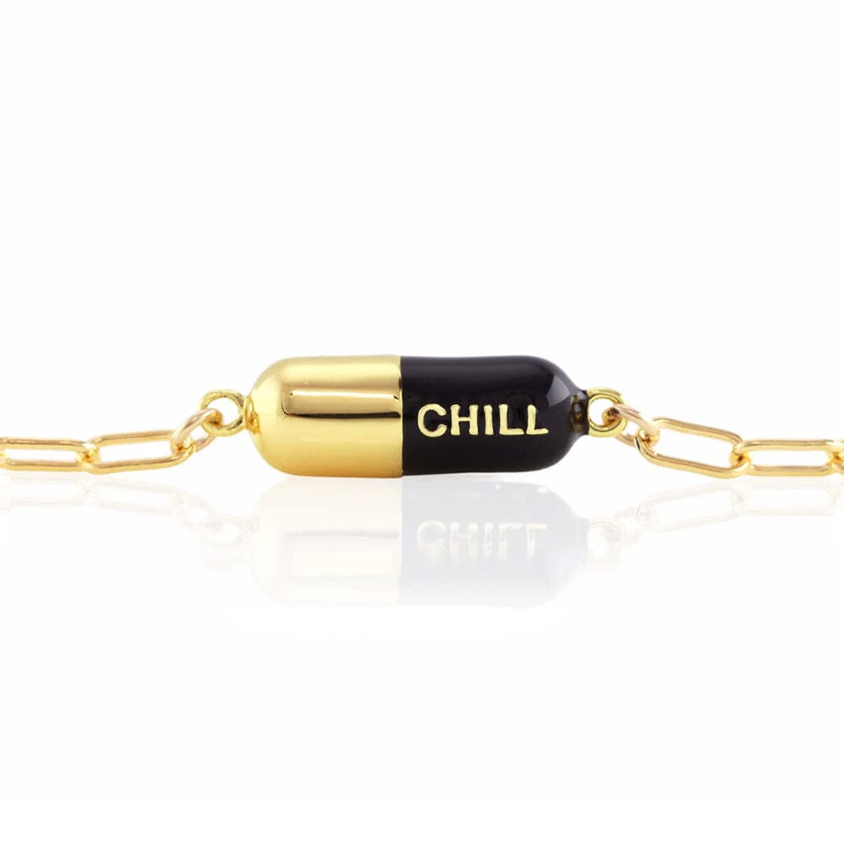 Black Chill Pill Bracelet on a gold link chain