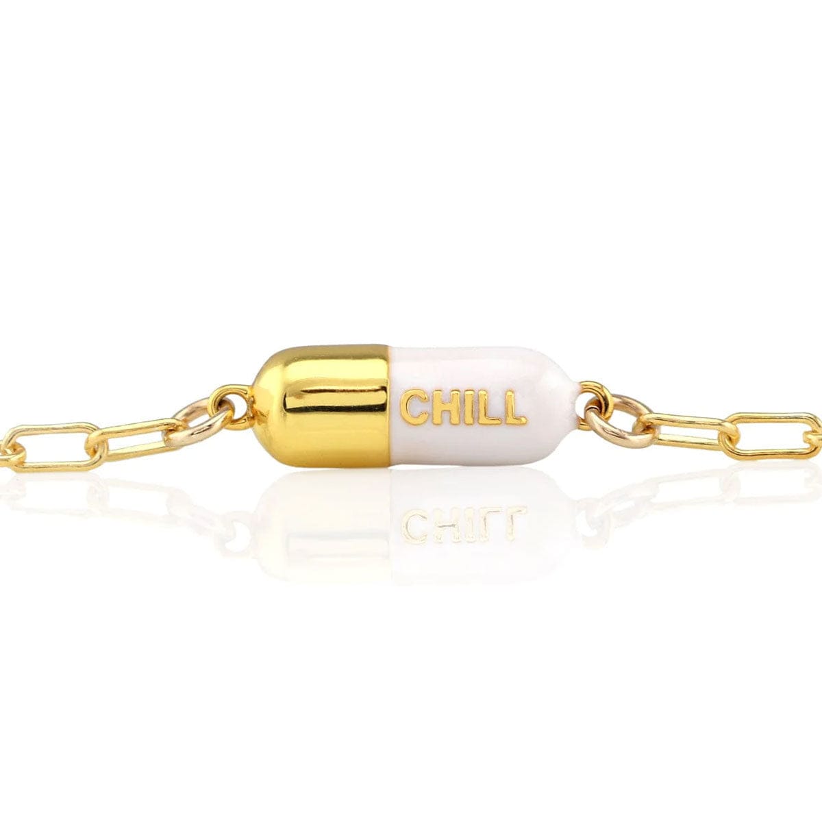 White Chill Pill Bracelet on a gold link chain