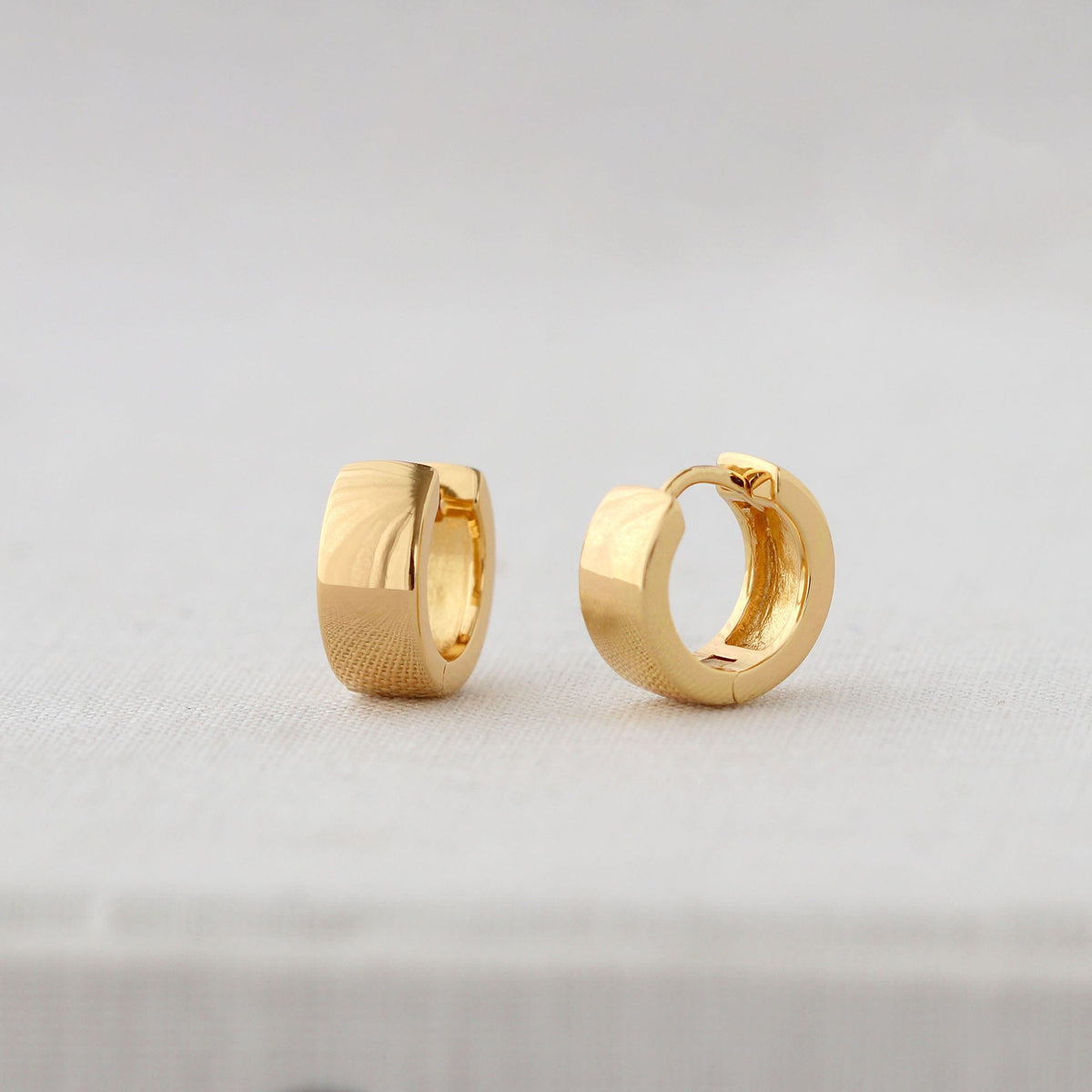 Wide Hinged Huggie Hoop Earrings in 18K gold vermeil