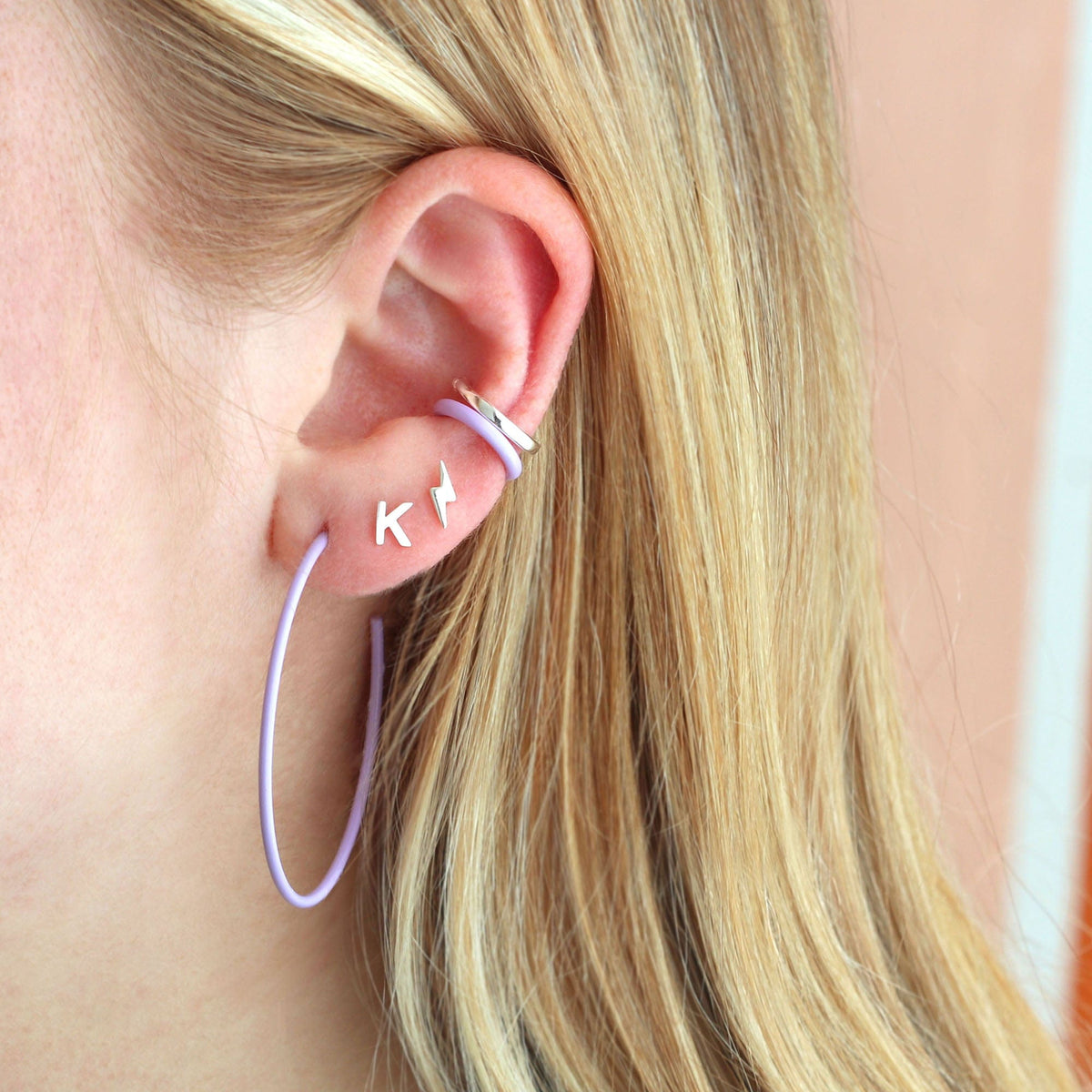 Periwinkle Palette Enamel Ear Cuff worn with star studs and a lavender hoop