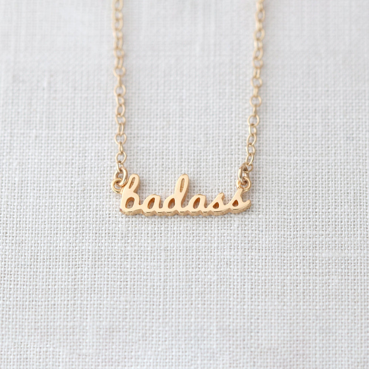 Gold Badass Charm Necklace with the word badass in script