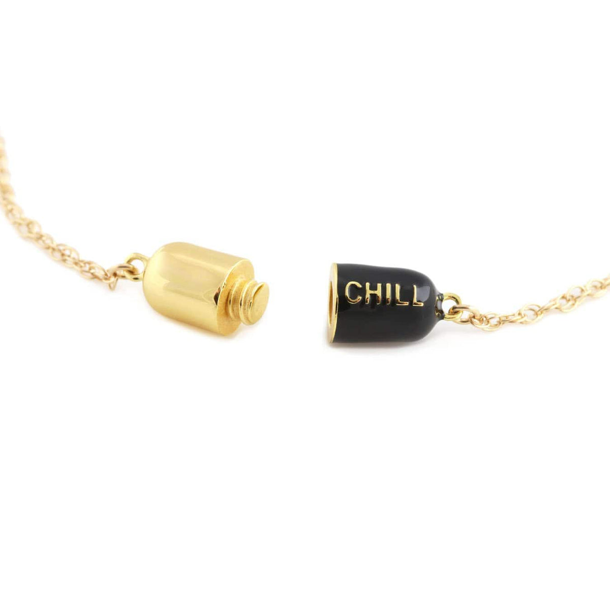 Black Big Chill Pill opened into two halves, showing how the pill unscrews